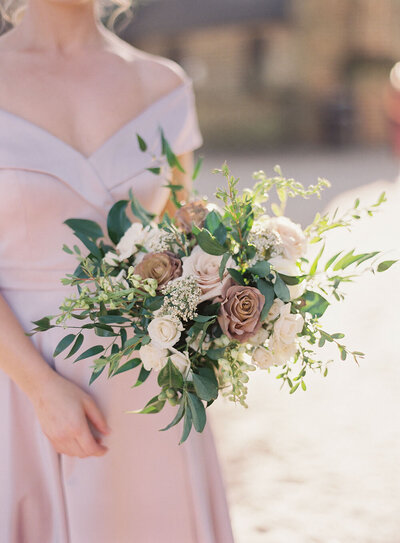 Fall bridesmaid bouquet with billowing greenery and cafe latte roses