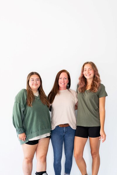 Ms. Kaleigh posing with two other teachers at the Nest, a preschool and learning center in Surf City, NC