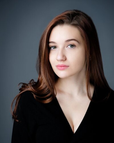 Corporate headshot in New Jersey of young professional woman with confident modern look