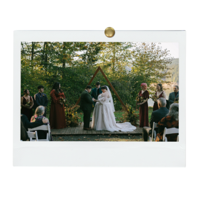 Brides at wedding their wedding ceremony, representing an example of work from Birdie June's event planning portfolio. 