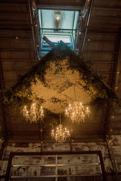 Chandeliers hanging from a barn
