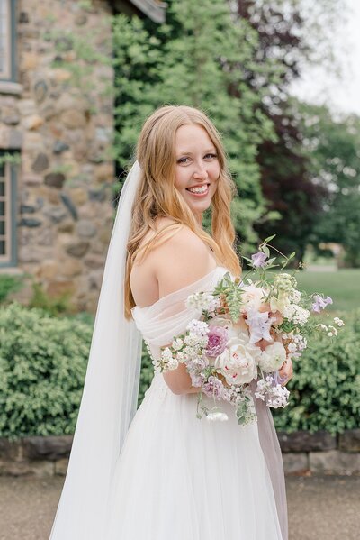 Bride holding bouquet at wedding at Beverly Mansion in Ohio