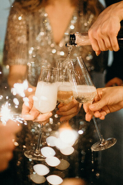 Canva - Person Pouring Champagne on Champagne Flutes (1)