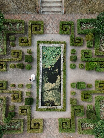 Aerial drone shot of formal gardens at Pauntley Court, by wedding photography studio, The Falkenburgs