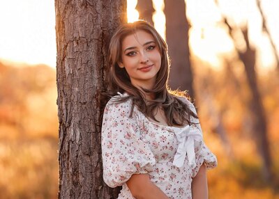 Senior girl posing on bridge at East Lake Shores in Thornton, Colorado.