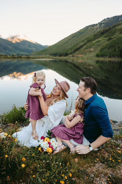 Family poses in wildflowers in Ouray, Colorado.