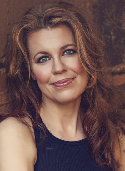AmyBeth Griffin, founder of Social Scene Travel, smiling outdoors