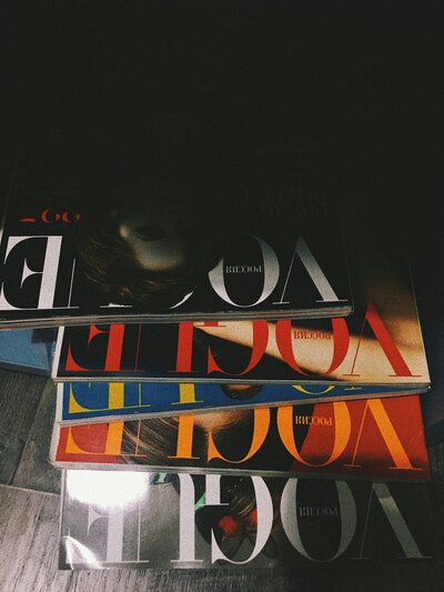 Flash photo of a stack of Vogue magazines