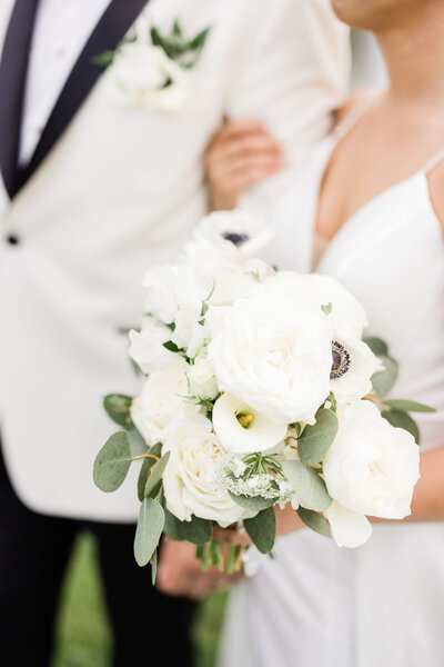 bride and groom holding eachother