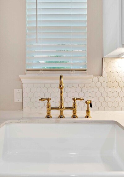 Kitchen sink and penny tile in this three-bedroom, two-bathroom vacation rental home with historical charm in Waco, TX.