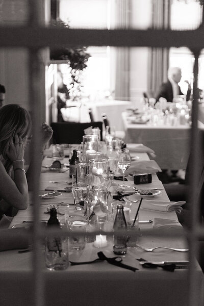 Reception table scape with cocktails and people mingling at a Maryland wedding 