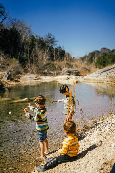 children playing in creek