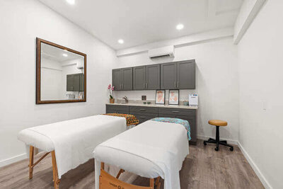 Ayurvedic therapy appointment room with mats, oils, and soothing ambiance