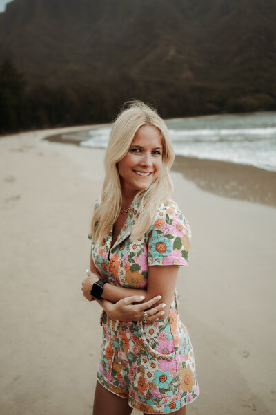 woman smiling holding a camera