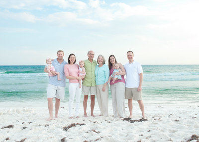 family on Rosemary beach in pastel clothing for family pictures