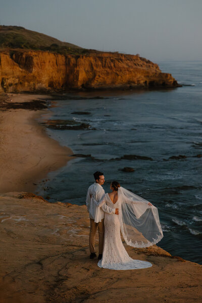 bride and groom walking and holding hands