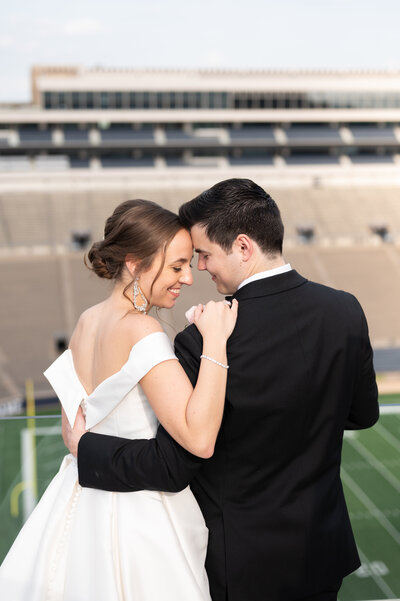 Bride and groom smile at each other