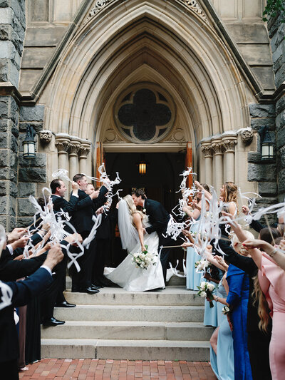 Bride and groom walk together at their fall wedding at Rust Manor