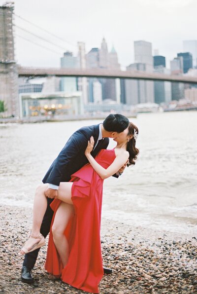 Fine Art Wedding Photography | Couple kissing in front of Boat House in Central Park