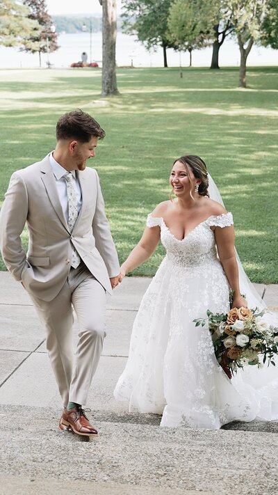 bride and groom walking up steps at Emerson Park Pavillion
