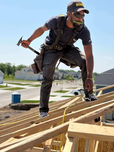 Construction project with builder working on residential home