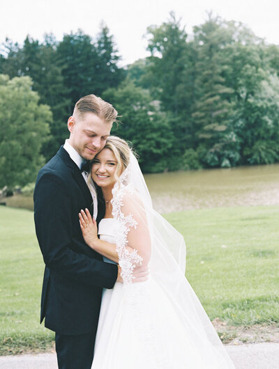Bride and groom embracing, taken by one of the top baltimore wedding photographers Nicole Simensky