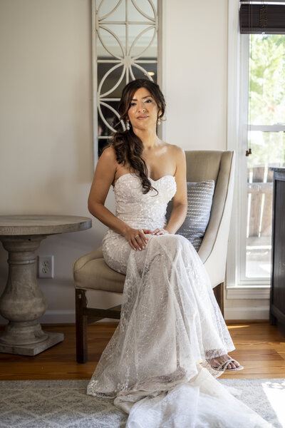 Bride holding Bouquet beside pillars