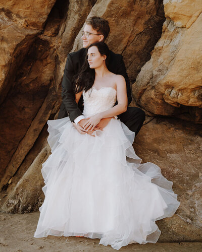 bride and groom looking off into the distance
