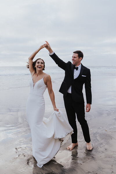 Elopement Photographer,  bride and groom stand before old truck with rock n' roll hand gestures