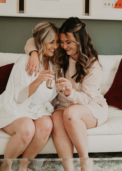 two sisters having a moment before the wedding by wedding planners in Denver