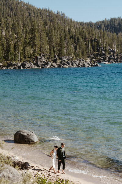 couple dancing on the sand at secret cove in lake tahoe