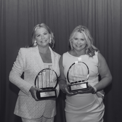Photo of Christa and Chanda holding awards