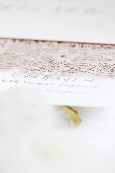 Pretty floral wedding invitations with laser cut details