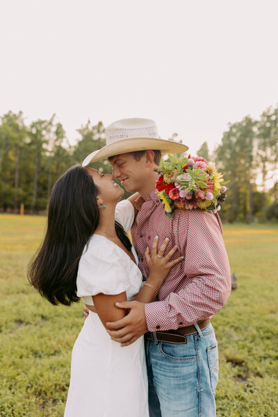 Couple rubbing noses, sharing sweet memories together at their engagement session in South Carolina 
