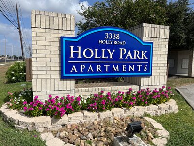 Entrance sign for Holly Park Apartments in Corpus Christi Texas marking the community managed by WLS Interests.