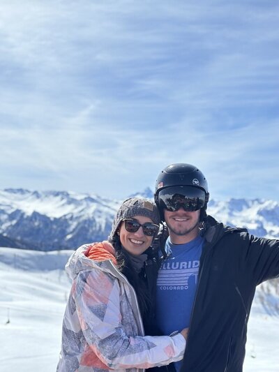 Couple posing at the ski mountain.