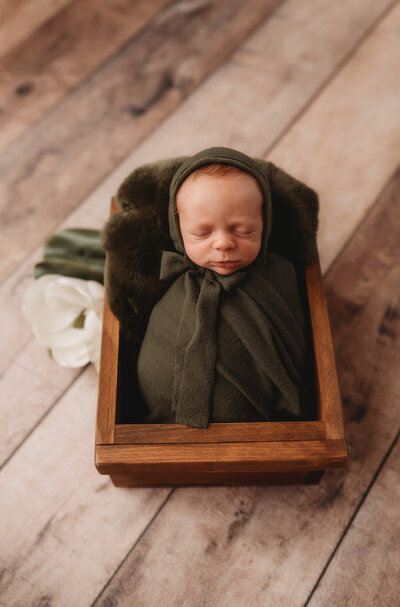Infant posed for Newborn Photoshoot in Charleston, SC.