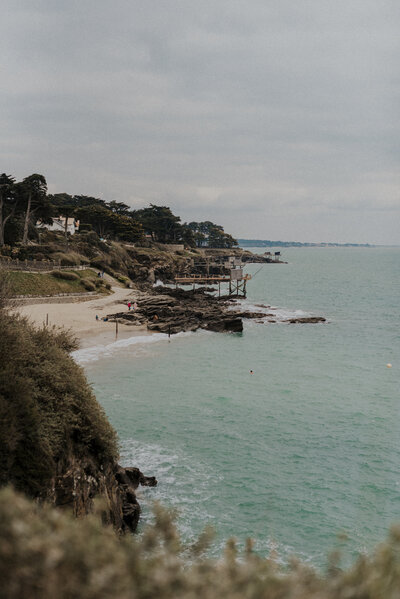 couple kissing and eloping on a mountain in the french alps