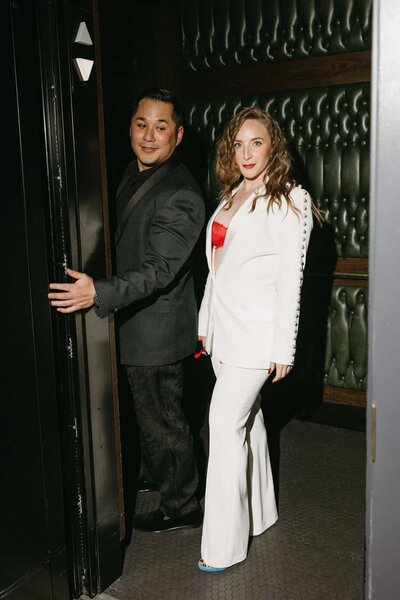 A wedding couple using the elevator at The Ramble in Denver Colorado