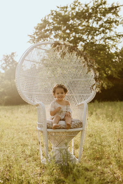 Melissa Hawkins' daughter photographed in peacock chair