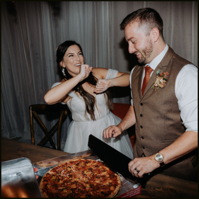 Nostalgic couple eats pizza in their kitchen