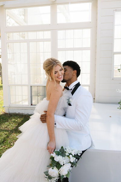 bride and groom looking at each other in houston park