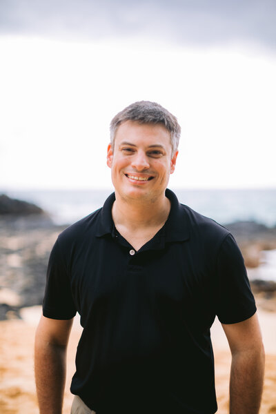 Portland and PNW wedding and elopement planner Shaun Collins headshot smiling at the camera