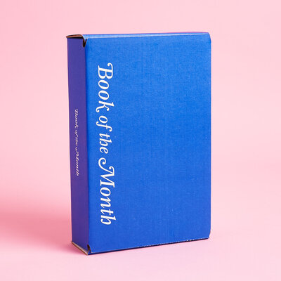 Blue box from Book of the Month Club on a pink background. 