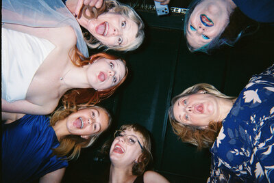 An indie LGBTQ+ couple’s moody editorial elopement portrait, photographed in a true-to-color style by Chelsea Stanford in Missouri