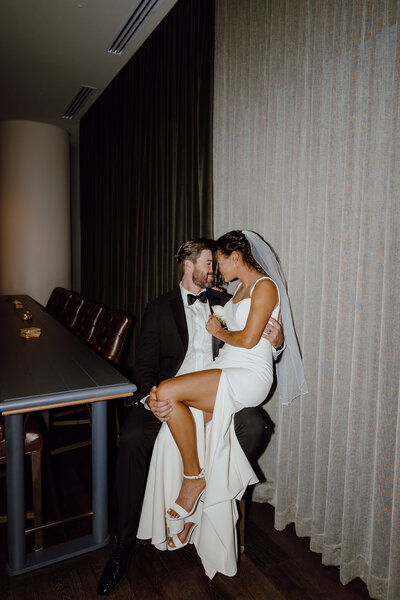 bride and groom embrace on wedding day