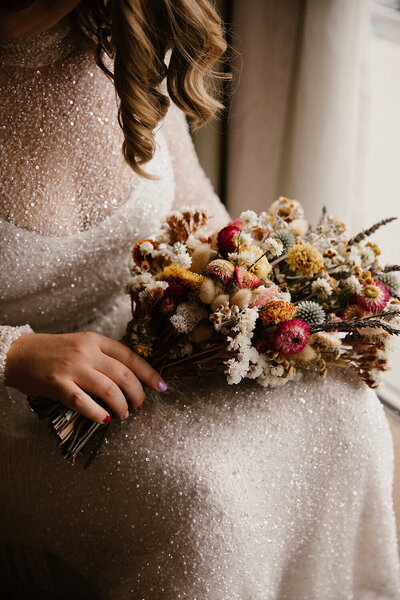 the glittering details on the brides brooke tyson wedding dress, photographed by aimee kelly, a taranaki wedding photographer