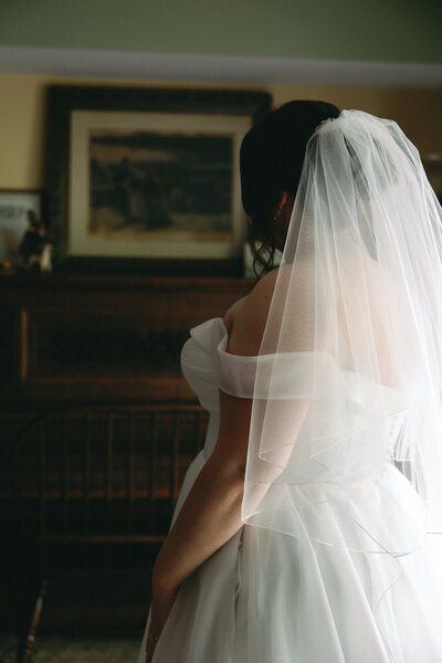 Bride smiling genuinely in natural light during wedding day in Cincinnati