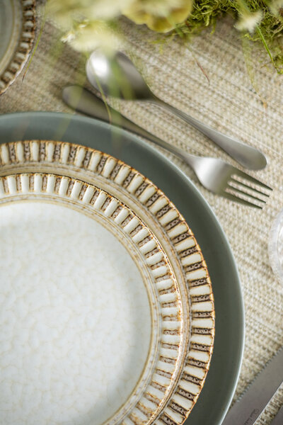 Embossed edge porcelain dinner plates set on a table