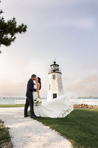 engagement photo on cape cod beach couple kissing